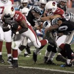 Arizona Cardinals' Edgerrin James (32) runs in for a touchdown against the Carolina Panthers during the first quarter of an NFL divisional playoff football game in Charlotte, N.C., Saturday, Jan. 10, 2009. (AP Photo/Rick Havner)