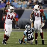 Arizona Cardinals' Gerald Hayes (54) celebrates after intercepting a pass intended for Carolina Panthers' Steve Smith (89) during the second quarter of an NFL divisional playoff football game in Charlotte, N.C., Saturday, Jan. 10, 2009. Arizona Cardinals' Antonio Smith (94) helps Smith up after the play. (AP Photo/Rick Havner)