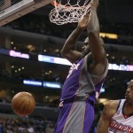 Phoenix Suns center Shaquille O'Neal dunks in front of Los Angeles Clippers center Marcus Camby during the first half of an NBA basketball game Sunday, Jan. 11, 2009, in Los Angeles. (AP Photo/Kevin Reece)