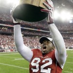 Arizona Cardinals defensive end Bertrand Berry holds the George Halas Trophy after the NFL NFC championship football game against the Philadelphia Eagles Sunday, Jan. 18, 2009, in Glendale, Ariz. The Cardinals won 32-25. (AP Photo/David J. Phillip)
