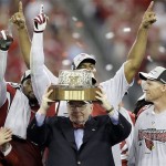 Arizona Cardinals owner William V. Bidwill holds up the George Halas Trophy after the NFL NFC championship football game against the Philadelphia Eagles Sunday, Jan. 18, 2009, in Glendale, Ariz. The Cardinals won 32-25. (AP Photo/Matt York)