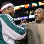 Olympian Tommie Smith, right, is greeted by Boston Celtics forward Paul Pierce during the first half of a NBA basketball game between the Boston Celtics and Phoenix Suns in Boston, Monday Jan. 19, 2009. Smith, who during the 1968 Olympics stood on the victory stand in Mexico City with his head bowed and his fist raised, was honored during the game.(AP Photo/Charles Krupa)