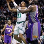 Boston Celtics guard Ray Allen (20) drives to the basket against Phoenix Suns center Shaquille O'Neal, right, during the first half of an NBA basketball game in Boston, Monday, Jan. 19, 2009. Allen had 20 points in the Celtics 104-87 win. At rear is Suns forward Grant Hill. (AP Photo/Charles Krupa)