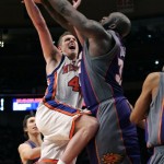 Phoenix Suns' Shaquille O'Neal (32) blocks a shot by New York Knicks' David Lee (42) during the second half of an NBA basketball game Wednesday, Jan. 21, 2009 in New York. The Knicks won the game 114-109. (AP Photo/Frank Franklin II)