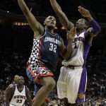 Charlotte Bobcats forward Boris Diaw (32), of France, shoots over Phoenix Suns center Amare Stoudemire (1) during the second half of the Bobcats' 98-76 win in an NBA basketball game in Charlotte, N.C., Friday, Jan. 23, 2009. (AP Photo/Chuck Burton)