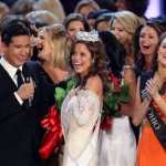 Miss Indiana Katie Stam, center, is crowned Miss America 2009 with host Mario Lopez, left, in Las Vegas on Saturday, Jan. 24, 2009. (AP Photo/Isaac Brekken)