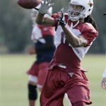 Arizona Cardinals wide receiver Larry Fitzgerald makes a catch during football practice Saturday, Jan. 24, 2009, at the team's practice facility in Tempe, Ariz. The Cardinals will play the Pittsburgh Steelers in Super Bowl XLIII in Tampa on Feb. 1. (AP Photo/Paul Connors)