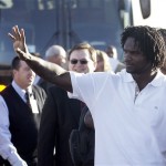 Arizona Cardinals runningback Edgerrin James waves to a group of fans who turned out for a rally as he prepares to board the football team's charter plane bound for the Super Bowl in Tampa Monday, Jan. 26, 2009, at Sky Harbor International Airport in Phoenix. The Cardinals will play the Pittsburgh Steelers in Super Bowl XLIII in Tampa on Feb. 1. (AP Photo/Paul Connors)