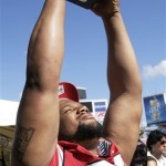 Arizona Cardinals defensive tackle Alan Branch hoists a trophy presented to him during the team's media day for Super Bowl XLIII Tuesday, Jan. 27, 2009, in Tampa, Fla. The Cardinals will play the Pittsburgh Steelers in the NFL Super Bowl football game on Sunday, Feb. 1. (AP Photo/Ross D. Franklin)
