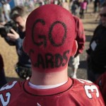 An Arizona Cardinals fan makes his way through the NFL Experience outside Raymond James Stadium the day before Super Bowl XLIII Saturday, Jan. 31, 2009 in Tampa, Fla. (AP Photo/Julie Jacobson)