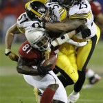 Arizona Cardinals wide receiver Anquan Boldin (81) is tackled by Pittsburgh Steelers linebacker James Farrior (51) and safety Ryan Clark during the third quarter of the NFL Super Bowl XLIII football game, Sunday, Feb. 1, 2009, in Tampa, Fla. (AP Photo/David J. Phillip)