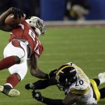 Arizona Cardinals wide receiver Anquan Boldin (81) is taken down by Pittsburgh Steelers cornerback Bryant McFadden (20) during the third quarter of the NFL Super Bowl XLIII football game, Sunday, Feb. 1, 2009, in Tampa, Fla. (AP Photo/John Bazemore)
