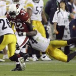 Arizona Cardinals safety Matt Ware (22) is tackled by Pittsburgh Steelers linebacker Lawrence Timmons (94) with Pittsburgh Steelers cornerback Deshea Townsend (26) approaching in the third quarter during the NFL Super Bowl XLIII football game, Sunday, Feb. 1, 2009, in Tampa, Fla. (AP Photo/Eric Gay)