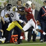 Pittsburgh Steelers wide receiver Santonio Holmes, left, breaks away from Arizona Cardinals defensive back Dominique Rodgers-Cromartie during the third quarter of the NFL Super Bowl XLIII football game, Sunday, Feb. 1, 2009, in Tampa, Fla. (AP Photo/David J. Phillip)