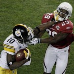 Pittsburgh Steelers wide receiver Santonio Holmes, left, breaks away from Arizona Cardinals defensive back Dominique Rodgers-Cromartie during the third quarter of the NFL Super Bowl XLIII football game, Sunday, Feb. 1, 2009, in Tampa, Fla. (AP Photo/Charlie Riedel)