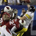 Pittsburgh Steelers quarterback Ben Roethlisberger (7) is hit by Arizona Cardinals defensive tackle Darnell Dockett (90) and Arizona Cardinals defensive end Bertrand Berry (92) after throwing the ball during the third quarter of the NFL Super Bowl XLIII football game, Sunday, Feb. 1, 2009, in Tampa, Fla. (AP Photo/Matt Slocum)