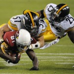Arizona Cardinals wide receiver Anquan Boldin (81) is tackled by Pittsburgh Steelers linebacker James Farrior (51) makes the tackle with help from Ryan Clark (25) during the third quarter of the NFL Super Bowl XLIII football game, Sunday, Feb. 1, 2009, in Tampa, Fla.(AP Photo/Mark J. Terrill)