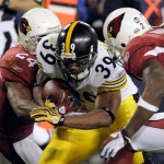 Pittsburgh Steelers running back Willie Parker (39) runs through Arizona Cardinals safety Adrian Wilson (24) and Antrel Rolle during the third quarter of the NFL Super Bowl XLIII football game, Sunday, Feb. 1, 2009, in Tampa, Fla. (AP Photo/Mark J. Terrill)