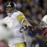 Pittsburgh Steelers quarterback Ben Roethlisberger, center, looks to pass as he is sacked by Arizona Cardinals defensive tackle Darnell Dockett during the fourth quarter of the NFL Super Bowl XLIII football game, Sunday, Feb. 1, 2009, in Tampa, Fla. (AP Photo/Gene J. Puskar)