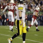 Pittsburgh Steelers quarterback Ben Roethlisberger reacts to a safety as Arizona Cardinals linebacker Karlos Dansby jumps in the background during the fourth quarter of the NFL Super Bowl XLIII football game, Sunday, Feb. 1, 2009, in Tampa, Fla. (AP Photo/Amy Sancetta)