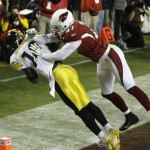 Pittsburgh Steelers wide receiver Santonio Holmes (10) makes a touchdown reception against Arizona Cardinals safety Aaron Francisco (47) during the fourth quarter of the NFL Super Bowl XLIII football game, Sunday, Feb. 1, 2009, in Tampa, Fla. (AP Photo/Matt Slocum)