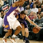 Sacramento Kings Beno Udrih, right, of Slovenia drives against Phoenix Suns Leandro Barbosa of Brazil during the second quarter of an NBA basketball game on Monday, Feb. 2, 2009, in Phoenix. (AP Photo/Rick Scuteri)
