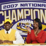 Fair Park High School's Morris Clairborne signed his national letter-of-intent to play NCAA college football at LSU as his mother Opal Claiborne, left, applaudes Wednesday, Feb. 4, 2009 in Shreveport, La. (AP Photo/The Shreveport Times, Jim Hudelson)