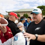Philadelphia Eagles head coach Andy Reid signs autographs after NFC Pro Bowl football practice aednesday, Feb. 4th, 2009 in Kapolei, Hawaii. Reid is head coach of the NFC team. (AP Photo/Marco Garcia)