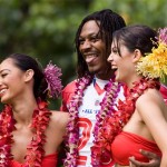 Buffalo Bills running back Marshawn Lynch hams it up with two hula girls during the AFC Pro Bowl football team photo session at the Ihilani Resort and Spa Friday, Feb. 6, 2009, in Kapolei, Hawaii. (AP Photo/Marco Garcia)