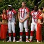 Miami Dolphins teammates Joey Porter, second from left, Jake Long, center, and Ronnie Brown, second from right, pose with models at the AFC Pro Bowl NFL football team photo session at the Ihilani Resort and Spa, Friday, Feb. 6, 2009, in Kapolei, Hawaii. (AP Photo/Marco Garcia)