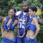 Chicago Bears Lance Briggs fools around with hula dancers while posing for photos before an NFC football practice at the Ko Olina Resort in Kapolei, Hawaii, Friday Feb. 6, 2009, in preparation for the Pro Bowl football game this Sunday. (AP Photo/Ronen Zilberman)