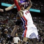 Detroit Pistons guard Allen Iverson is fouled by Phoenix Suns' forward Louis Amundson (17) while going to the basket in the second half of an NBA basketball game Sunday, Feb. 8, 2009, in Auburn Hills, Mich. The Suns beat the Pistons 107-97. (AP Photo/Duane Burleson)