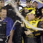 Matt Kenseth sprays champagne after winning the rain-shortened NASCAR Daytona 500 auto race at Daytona International Speedway in Daytona Beach, Fla., Sunday, Feb. 15, 2009. (AP Photo/Terry Renna)