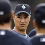 Seattle Mariners manager Don Wakamatsu talks to his players during baseball spring training Monday, Feb. 16, 2009 in Peoria, Ariz. (AP Photo/Charlie Riedel)