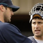 Seattle Mariners catcher Jamie Burke, right, and pitcher Ryan Rowland-Smith talk during baseball spring training Monday, Feb. 16, 2009 in Peoria, Ariz. (AP Photo/Charlie Riedel)