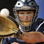 Seattle Mariners catcher Jamie Burke catches a ball during baseball spring training Monday, Feb. 16, 2009 in Peoria, Ariz. (AP Photo/Charlie Riedel)