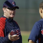 Cleveland Indians manager Eric Wedge, left, talk with Grady Sizemore about base running during workouts at the Indians spring training facility on Tuesday, Feb. 17, 2009, in Goodyear, Ariz. (AP Photo/Ross D. Franklin)