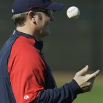 Cleveland Indians manager Eric Wedge tosses the ball as he watches players during workouts at the Indians spring training facility Tuesday, Feb. 17, 2009, in Goodyear, Ariz. (AP Photo/Ross D. Franklin)