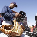 Cleveland Indians' Josh Barfield takes a look at new Rawlings baseball glove after morning workouts at the Indians spring training facility Tuesday, Feb. 17, 2009, in Goodyear, Ariz. (AP Photo/Ross D. Franklin)
