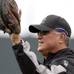 Colorado Rockies manager Clint Hurdle calls for a ball to throw during workouts for pitchers and catchers Tuesday, Feb. 17, 2009, during spring training baseball in Tucson, Ariz. (AP Photo/Elaine Thompson)