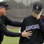 Colorado Rockies bullpen coach Jim Wright, left, talks with pitcher Jeff Francis at the first day of workouts for pitchers and catchers Sunday, Feb. 15, 2009, during spring training baseball in Tucson, Ariz. Francis announced Thursday, Feb. 19, that he would be having surgery on his left shoulder. (AP Photo/Elaine Thompson)