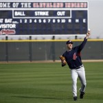 Cleveland Indians pitcher Cliff Lee throws during warm-ups for spring training baseball workouts Sunday, Feb 22, 2009, in Goodyear, Ariz. (AP Photo/Paul Connors)