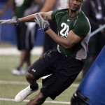 Georgia Tech defensive lineman Michael Johnson runs a football drill at the NFL scouting combine in Indianapolis, Monday, Feb. 23, 2009. (AP Photo/Michael Conroy)