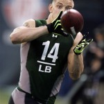 Ohio State linebacker James Laurinaitis makes a catch as he runs a football drill at the NFL scouting combine in Indianapolis, Monday, Feb. 23, 2009. (AP Photo/Michael Conroy)