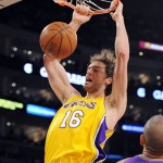 Los Angeles Lakers forward Pau Gasol, of Spain, dunks as Phoenix Suns forward Grant Hill (33) looks on during the first half of an NBA basketball game Thursday, Feb. 26, 2009, in Los Angeles. (AP Photo/Mark J. Terrill)