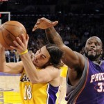 Phoenix Suns center Shaquille O'Neal (32) hits Los Angeles Lakers guard Sasha Vujacic (18), of Slovenia, on the head as he goes up for a shot during the first half of their NBA basketball game Thursday, Feb. 26, 2009, in Los Angeles. (AP Photo/Mark J. Terrill)
