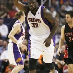 Phoenix Suns Shaquille O'Neal celebrates scoring his 45th point on a free throw against the Toronto Raptors in the fourth quarter of an NBA basketball game in Phoenix Friday, Feb. 27, 2009. O'Neal scored 45 points in his biggest offensive performance in six years. The Suns won 133-113. (AP Photo/Aaron J. Latham)