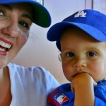 Bridget Gordon holds 1-year-old Myles, a Dodgers fan, at Camelback Ranch, Sunday, March 1, 2009. It was the first game held at the stadium. (Rose Clements/KTAR)(Rose Clements/KTAR)