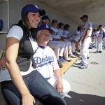 Singer Jordin Sparks sits with former Los Angeles Dodgers manager Tommy Lasorda before a spring training baseball game at Camelback Ranch on Sunday, March 1, 2009, in Phoenix. (AP Photo/Morry Gash)