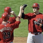 Arizona Diamondbacks' Chris Snyder, right, is congratulated by Josh Whitesell (29) and Chad Tracy after hitting a three-run home run during the fourth inning of a spring training baseball game Monday, March 2, 2009, in Mesa, Ariz. (AP Photo/Morry Gash)